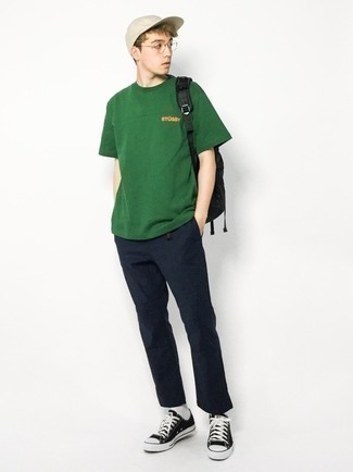 Dark Green Crew-neck T-shirt Outfits For Men: A dark green crew-neck t-shirt and navy chinos are wonderful menswear must-haves that will integrate perfectly within your daily casual repertoire. Go for a pair of black and white canvas low top sneakers and ta-da: this look is complete.