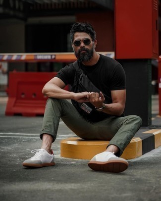 White and Red Leather Low Top Sneakers Hot Weather Outfits For Men: This pairing of a black crew-neck t-shirt and olive chinos is ideal for off-duty days. Add a pair of white and red leather low top sneakers to your outfit and ta-da: the outfit is complete.