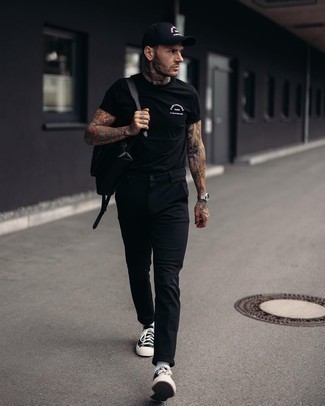 Men's Black Crew-neck T-shirt, Black Chinos, Black and White Canvas Low Top Sneakers, Black Leather Backpack