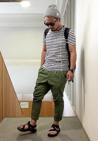 Black Canvas Sandals Outfits For Men: A white and black horizontal striped crew-neck t-shirt and olive chinos make for the ultimate casual ensemble for any modern guy. To give your outfit a more laid-back feel, complement this outfit with black canvas sandals.