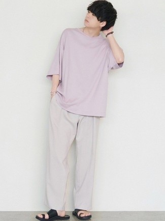 Grey Chinos Outfits: Extra stylish, this off-duty combo of a light violet crew-neck t-shirt and grey chinos provides with amazing styling possibilities. Finishing with black leather sandals is the most effective way to introduce a dose of stylish nonchalance to your getup.