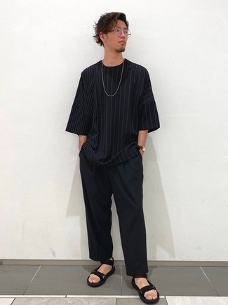 Black Canvas Sandals Outfits For Men: Go for a pared down but cool and casual choice by wearing a black vertical striped crew-neck t-shirt and black chinos. A pair of black canvas sandals easily revs up the cool of this look.
