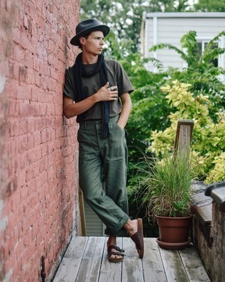 Sandals Outfits For Men: A charcoal crew-neck t-shirt and dark green chinos are an easy way to introduce some cool into your current wardrobe. For something more on the daring side to complete your outfit, complete this ensemble with sandals.