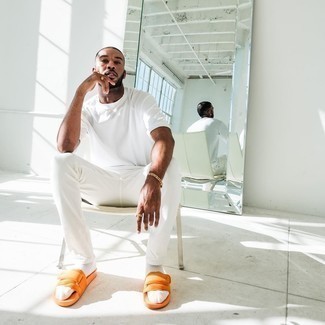 Orange Canvas Sandals Outfits For Men: A white crew-neck t-shirt and white chinos are an easy way to introduce effortless cool into your casual styling collection. When this ensemble looks too classic, dial it down by sporting orange canvas sandals.