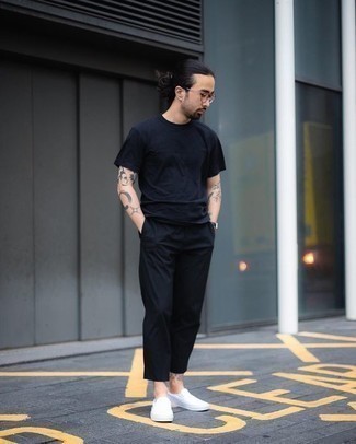 White Canvas Slip-on Sneakers Outfits For Men: For an outfit that's pared-down but can be flaunted in many different ways, opt for a navy crew-neck t-shirt and black chinos. Add a pair of white canvas slip-on sneakers to this outfit and you're all set looking killer.