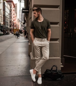 White Canvas Slip-on Sneakers Outfits For Men: For a cool and casual look, consider wearing an olive crew-neck t-shirt and beige chinos — these pieces go really well together. White canvas slip-on sneakers finish this ensemble quite well.