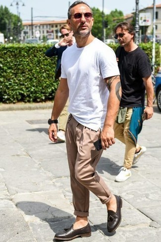 Beige Chinos Hot Weather Outfits: This combination of a white crew-neck t-shirt and beige chinos is on the casual side but is also seriously stylish and seriously sharp. And if you want to easily kick up your ensemble with footwear, why not introduce a pair of dark brown leather tassel loafers to your outfit?