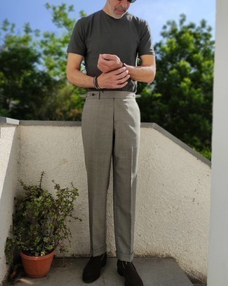 Charcoal Crew-neck T-shirt Outfits For Men: When the setting calls for a casually sleek ensemble, you can go for a charcoal crew-neck t-shirt and grey dress pants. Ramp up the formality of this look a bit by wearing dark brown suede loafers.