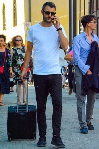 Black Suitcase Outfits For Men: Reach for a white crew-neck t-shirt and a black suitcase to get a casual street style and stylish getup. You could go down a classier route on the shoe front by finishing with black athletic shoes.