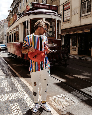 Orange Canvas Fanny Pack Outfits For Men: Consider pairing a multi colored vertical striped crew-neck t-shirt with an orange canvas fanny pack to feel infinitely confident in yourself and look stylish. White and blue athletic shoes will dress up your ensemble.