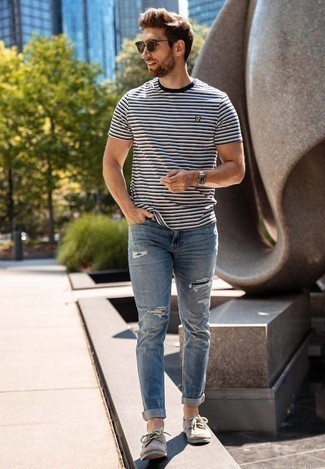 Navy Ripped Jeans Outfits For Men: A navy and white horizontal striped crew-neck t-shirt and navy ripped jeans are a modern casual pairing that every modern gent should have in his off-duty styling collection. If you need to easily dial up this look with footwear, complete your getup with a pair of tan suede boat shoes.