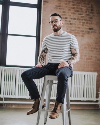 Grey Horizontal Striped Crew-neck T-shirt Outfits For Men: For a laid-back look with a street style spin, dress in a grey horizontal striped crew-neck t-shirt and charcoal jeans. Finishing with brown leather casual boots is a fail-safe way to give an extra touch of polish to your look.