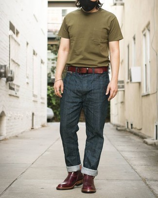 Burgundy Leather Chelsea Boots Outfits For Men: Definitive proof that an olive crew-neck t-shirt and navy jeans look awesome if you pair them together in a laid-back look. A pair of burgundy leather chelsea boots will dress up any getup.