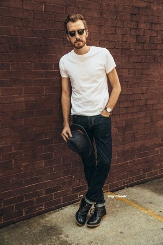 Black Leather Desert Boots Outfits: This casual combination of a white crew-neck t-shirt and navy jeans is a never-failing option when you need to look casual and cool in a flash. To introduce a bit of classiness to your outfit, add a pair of black leather desert boots to this ensemble.