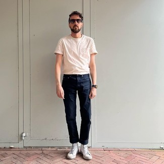 Beige Crew-neck T-shirt Outfits For Men: If the situation permits laid-back styling, you can opt for a beige crew-neck t-shirt and navy jeans. On the shoe front, go for something on the laid-back end of the spectrum and finish this outfit with white canvas high top sneakers.