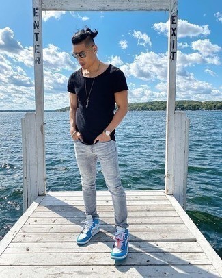 White and Blue High Top Sneakers Outfits For Men: Extra stylish and practical, this off-duty combo of a navy crew-neck t-shirt and grey jeans provides with wonderful styling possibilities. For a modern on and off-duty mix, introduce white and blue high top sneakers to the equation.
