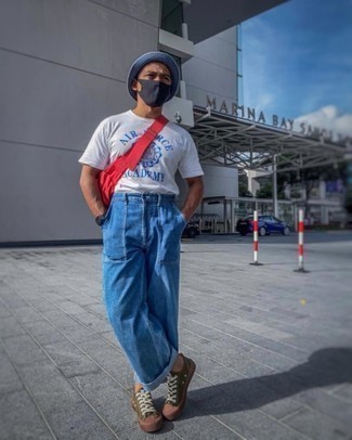 Bucket Hat Outfits For Men: A white and blue print crew-neck t-shirt and a bucket hat worn together are a sartorial dream for those dressers who appreciate casual combos. Olive canvas low top sneakers are a surefire way to breathe an extra dose of polish into this ensemble.