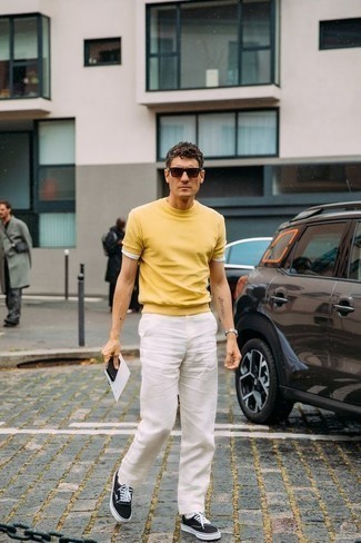 Men's Mustard Crew-neck T-shirt, White Jeans, Black and White Canvas Low Top Sneakers, Dark Brown Sunglasses