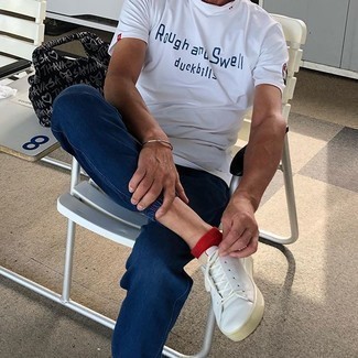 White and Navy Print Crew-neck T-shirt Outfits For Men: For a casual outfit, try teaming a white and navy print crew-neck t-shirt with navy jeans — these two items fit perfectly together. We're loving how this whole outfit comes together thanks to white leather low top sneakers.