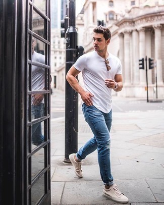 Beige Suede Low Top Sneakers Outfits For Men: If the situation permits casual city dressing, marry a white crew-neck t-shirt with blue ripped jeans. You can get a little creative with footwear and spruce up this look by finishing with beige suede low top sneakers.