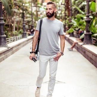 White Jeans Outfits For Men: For a laid-back getup with a modern twist, dress in a grey crew-neck t-shirt and white jeans. The whole ensemble comes together wonderfully if you complement your look with a pair of beige canvas low top sneakers.