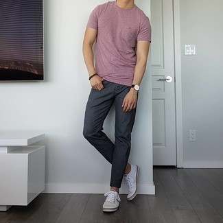 1200+ Casual Hot Weather Outfits For Men: A pink crew-neck t-shirt and charcoal jeans are a smart pairing worth having in your daily styling arsenal. Complement this look with a pair of white canvas low top sneakers and ta-da: your look is complete.