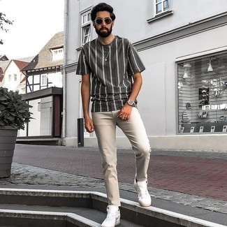 Men's Charcoal Vertical Striped Crew-neck T-shirt, Grey Jeans, White Canvas Low Top Sneakers, Dark Brown Sunglasses
