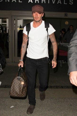 David Beckham wearing White Crew-neck T-shirt, Black Jeans, Dark Brown Suede Oxford Shoes, Black Backpack