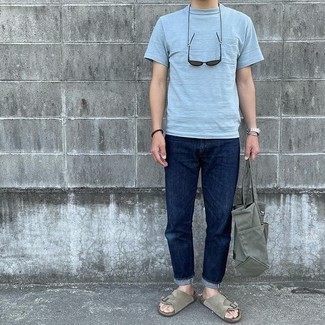 121 Relaxed Outfits For Men: This off-duty pairing of a light blue crew-neck t-shirt and navy jeans is a fail-safe option when you need to look dapper in a flash. To give your outfit a more laid-back touch, why not add a pair of grey suede sandals to the mix?