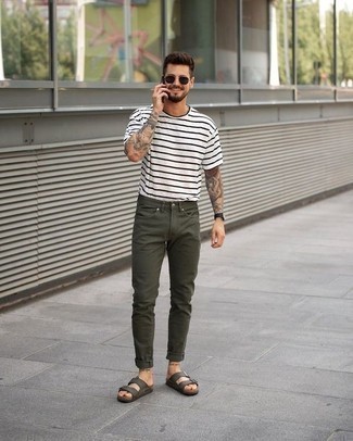 Olive Jeans Outfits For Men: A white and black horizontal striped crew-neck t-shirt looks especially cool when paired with olive jeans in a relaxed casual menswear style. To add an air of stylish casualness to your look, introduce olive leather sandals to the equation.