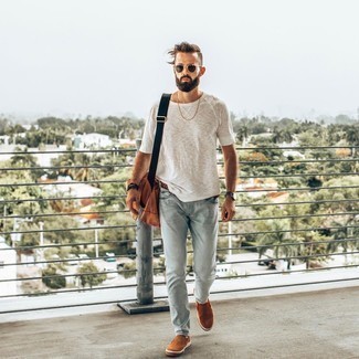 Tobacco Canvas Messenger Bag Outfits: A white crew-neck t-shirt and a tobacco canvas messenger bag matched together are a perfect match. Dial up the classiness of your outfit a bit by finishing with a pair of tobacco suede slip-on sneakers.