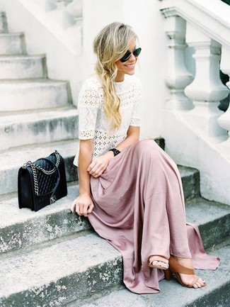 Pink Maxi Skirt Outfits: A white lace crew-neck t-shirt and a pink maxi skirt paired together are such a dreamy look for fashionistas who appreciate relaxed getups. Complete your outfit with a pair of tan leather heeled sandals to easily up the glam factor of any look.