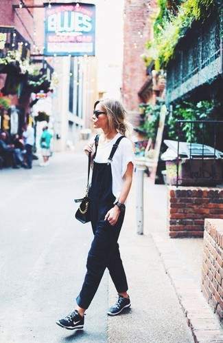 Black and White Athletic Shoes Outfits For Women: This combination of a white crew-neck t-shirt and black overalls is irrefutable proof that a pared down casual outfit doesn't have to be boring. A pair of black and white athletic shoes introduces just the right amount of playfulness to this outfit.