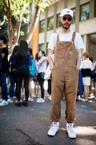 Beige Overalls Outfits For Men: A white crew-neck t-shirt and beige overalls are a casual street style combination that every modern gentleman should have in his casual wardrobe. If you don't know how to finish, introduce white canvas high top sneakers to the equation.