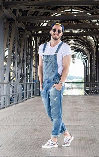 Denim Overalls With Abrasions And Raw Hem In Mid Blue