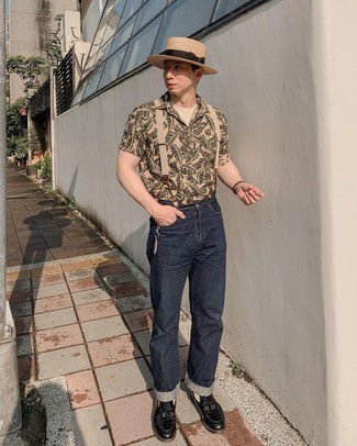 Tan Print Polo Outfits For Men: A tan print polo and navy jeans will give off this relaxed and dapper vibe. You can get a bit experimental on the shoe front and introduce black leather tassel loafers to the mix.