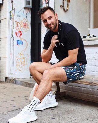 Blue Print Shorts Outfits For Men: When comfort is crucial, try teaming a black and white print crew-neck t-shirt with blue print shorts. Introduce a pair of white athletic shoes to the mix to make a traditional outfit feel suddenly edgier.