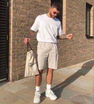 Beige Shorts Outfits For Men: Go for a pared down yet casual and cool choice by wearing a white crew-neck t-shirt and beige shorts. A nice pair of white athletic shoes is an easy way to transform your ensemble.