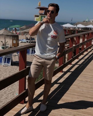 Tan Shorts Outfits For Men: Go for a white print crew-neck t-shirt and tan shorts for a modern twist on casual street style. Not sure how to round off this look? Wear beige canvas espadrilles to elevate it.