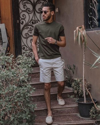 White Vertical Striped Canvas Espadrilles Outfits For Men: An olive crew-neck t-shirt and white shorts are amazing menswear staples that will integrate well within your casual arsenal. For maximum effect, complete this look with white vertical striped canvas espadrilles.