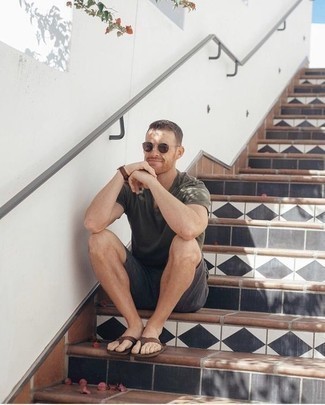 Tobacco Leather Flip Flops Outfits For Men: This combination of an olive crew-neck t-shirt and charcoal shorts spells versatility and stylish practicality. A pair of tobacco leather flip flops effortlessly boosts the street cred of your look.