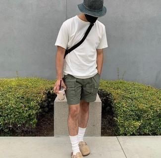 Tan Suede Loafers Outfits For Men: Combining a white crew-neck t-shirt and olive shorts will prove your skills in men's fashion even on lazy days. Want to go all out on the shoe front? Complement this look with a pair of tan suede loafers.