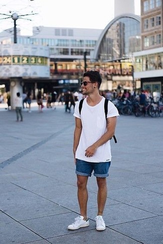 Blue Denim Shorts Outfits For Men: Opt for a white crew-neck t-shirt and blue denim shorts to put together a razor-sharp and current casual ensemble. Consider white leather low top sneakers as the glue that will bring your look together.