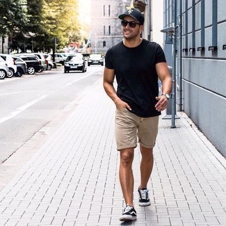 Tan Denim Shorts Outfits For Men: To achieve a casual getup with a modern twist, you can rely on a black crew-neck t-shirt and tan denim shorts. A pair of black and white canvas low top sneakers looks great here.