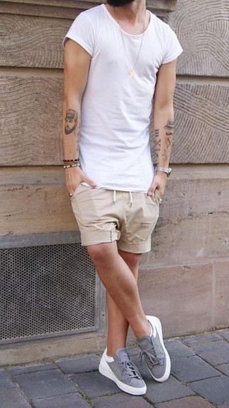 Tan Shorts Outfits For Men: For effortless style without the need to sacrifice on practicality, we love this combination of a white crew-neck t-shirt and tan shorts. If you're puzzled as to how to round off, complete your ensemble with a pair of grey canvas low top sneakers.