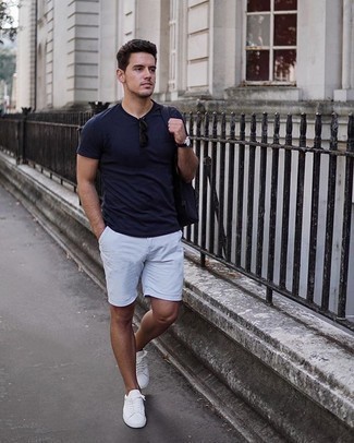 Navy Backpack Outfits For Men: Rock a navy crew-neck t-shirt with a navy backpack to pull together a street style and stylish look. Balance out your outfit with a more polished kind of footwear, such as this pair of white canvas low top sneakers.