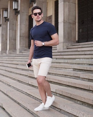 Beige Denim Shorts Outfits For Men: If it's ease and functionality that you're searching for in menswear, marry a navy crew-neck t-shirt with beige denim shorts. For extra style points, add white canvas low top sneakers to the mix.