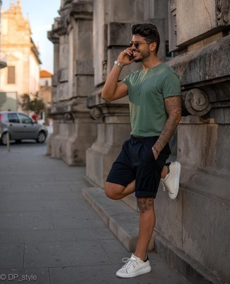 Navy Shorts Outfits For Men: Show off your style-savvy side in a mint crew-neck t-shirt and navy shorts. Complement this ensemble with a pair of white and black leather low top sneakers et voila, the getup is complete.