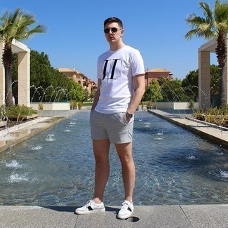 White Shorts Outfits For Men: To create a casual ensemble with an urban take, you can easily rely on a white and black print crew-neck t-shirt and white shorts. When it comes to shoes, this look pairs wonderfully with white and black leather low top sneakers.