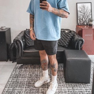 Silver Shorts Outfits For Men: For comfort dressing with a modern finish, rock a light blue crew-neck t-shirt with silver shorts. If in doubt about what to wear when it comes to shoes, complete this getup with white leather low top sneakers.